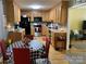 Open kitchen with stainless steel appliances, oak cabinets, and hardwood flooring at 2339 Wednesbury Ct, Kannapolis, NC 28083