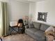 Living room with a comfortable gray sofa and decorative accents at 2339 Wednesbury Ct, Kannapolis, NC 28083