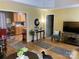 Open living room with hardwood floors flowing into the kitchen at 2339 Wednesbury Ct, Kannapolis, NC 28083