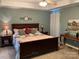 Comfortable main bedroom with a king-size bed, soft carpet, and decorative elements at 2339 Wednesbury Ct, Kannapolis, NC 28083