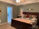 Spacious main bedroom featuring carpet, a king bed, and an adjoining bathroom at 2339 Wednesbury Ct, Kannapolis, NC 28083