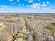 Breathtaking aerial view of the neighborhood surrounded by lush forests and beautiful landscaping at 242 Delview Dr, Cherryville, NC 28021