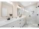 Modern bathroom featuring a dual sink vanity and a glass-enclosed shower at 242 Delview Dr, Cherryville, NC 28021