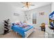Bright bedroom with carpet floors, natural light, and playful decor at 242 Delview Dr, Cherryville, NC 28021