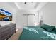 Bright bedroom featuring carpet floors, tray ceilings, and modern decor at 242 Delview Dr, Cherryville, NC 28021