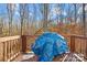 A covered grill is on the beautiful wooden deck, perfect for cooking outdoors at 242 Delview Dr, Cherryville, NC 28021