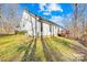 Charming home exterior with a deck, surrounded by lush greenery and a well-maintained yard at 242 Delview Dr, Cherryville, NC 28021