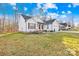 Exterior showcasing this lovely home with wood accents and well-maintained landscaping and lawn at 242 Delview Dr, Cherryville, NC 28021