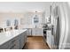 Modern kitchen with an island, stainless steel appliances, white subway tile backsplash, and open layout at 242 Delview Dr, Cherryville, NC 28021