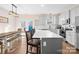 Bright kitchen featuring white cabinets, stainless steel appliances, and an island with seating at 242 Delview Dr, Cherryville, NC 28021