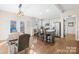 Well-lit kitchen featuring a gray island, bar seating, and stainless steel appliances at 242 Delview Dr, Cherryville, NC 28021