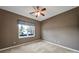 Cozy bedroom with carpet, neutral paint, and a ceiling fan at 28129 Song Sparrow Ln, Fort Mill, SC 29707