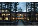 A night time view of the clubhouse, as seen from the bridge leading to it at 28129 Song Sparrow Ln, Fort Mill, SC 29707
