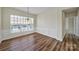 Dining room with wood floors, and a large window that provides ample natural light and backyard view at 28129 Song Sparrow Ln, Fort Mill, SC 29707