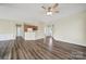 Open-concept living area features modern floors and neutral paint, seamlessly connecting to the kitchen for easy entertaining at 28129 Song Sparrow Ln, Fort Mill, SC 29707