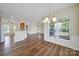 Open living spaces with abundant natural light, connecting dining, living, and kitchen areas for seamless living at 28129 Song Sparrow Ln, Fort Mill, SC 29707