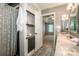 An elegant bathroom featuring a double vanity, a framed mirror, and a shower with a curtain at 292 Rose St, Mooresville, NC 28117