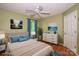 A decorated bedroom featuring soft blue accents, a king size bed, and windows providing natural light at 292 Rose St, Mooresville, NC 28117