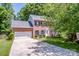 Beautiful front exterior of brick home with an attached two-car garage at 292 Rose St, Mooresville, NC 28117