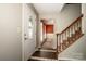 Inviting foyer featuring tile flooring, stairs, and a decorative front door with glass detail at 292 Rose St, Mooresville, NC 28117