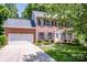 Beautiful brick home with a two car garage and mature landscaping at 292 Rose St, Mooresville, NC 28117