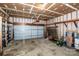 View of the open garage with concrete floors and a two car garage door at 292 Rose St, Mooresville, NC 28117
