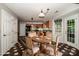 Kitchen with stainless steel appliances, granite counters, wood cabinets, pendant lighting and checkerboard flooring at 292 Rose St, Mooresville, NC 28117