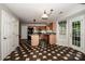 Kitchen with stainless steel appliances, granite counters, wood cabinets, pendant lighting and checkerboard flooring at 292 Rose St, Mooresville, NC 28117