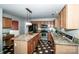Kitchen with stainless steel appliances, granite counters, wood cabinets, pendant lighting and checkerboard flooring at 292 Rose St, Mooresville, NC 28117