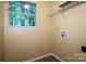 The laundry room features wire shelving for storage, a utility sink, and a window for natural light at 292 Rose St, Mooresville, NC 28117