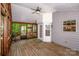The spacious screened-in porch offers wood floors, lots of light, and access to the backyard at 292 Rose St, Mooresville, NC 28117