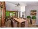 The screened-in porch features wood floors, ceiling fan, and a table set with lemons for outdoor dining at 292 Rose St, Mooresville, NC 28117