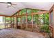 The screened-in porch offers wood floors and lots of natural light, perfect for relaxing and enjoying the outdoors at 292 Rose St, Mooresville, NC 28117