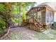 View of screened porch, deck, and stairs leading to backyard at 292 Rose St, Mooresville, NC 28117