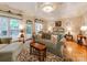 Bedroom features a sitting area, hardwood floors, and a ceiling fan with decorative ceiling at 3044 Luke Crossing Dr, Charlotte, NC 28226
