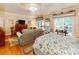 This bedroom features a sitting area, hardwood floors, and a decorative ceiling fan at 3044 Luke Crossing Dr, Charlotte, NC 28226