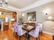 Traditional dining area with hardwood floors, modern lighting, and decorative artwork at 3044 Luke Crossing Dr, Charlotte, NC 28226