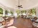 Inviting gazebo interior with comfortable wicker seating and a ceiling fan to stay cool at 3044 Luke Crossing Dr, Charlotte, NC 28226