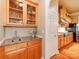 Charming bar and kitchenette area with granite countertops and wooden cabinets at 3044 Luke Crossing Dr, Charlotte, NC 28226