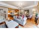 Cozy living room with hardwood floors, opening to dining and kitchen areas at 3044 Luke Crossing Dr, Charlotte, NC 28226