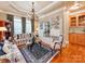 Elegant living room with hardwood floors, tray ceilings, and custom built-ins at 3044 Luke Crossing Dr, Charlotte, NC 28226