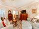 Cozy living room features two sofas, a decorative rug, and traditional wallpaper at 3044 Luke Crossing Dr, Charlotte, NC 28226