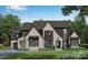Beautiful brick two-story home with a landscaped front yard at 306 Sugar Maple Ln, Matthews, NC 28104