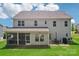 Home's rear exterior includes a covered porch and patio perfect for outdoor entertaining and relaxation at 3218 Gilroy Dr, Fort Mill, SC 29707
