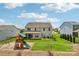 Expansive backyard features a well-maintained lawn and play structure, ideal for Gathering fun at 3218 Gilroy Dr, Fort Mill, SC 29707