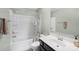 Neutral bathroom featuring a shower-tub combo and a dark vanity at 3218 Gilroy Dr, Fort Mill, SC 29707