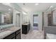 Primary bathroom showcasing the double vanity, glass shower, and tub at 3218 Gilroy Dr, Fort Mill, SC 29707