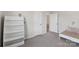 Cozy bedroom with neutral walls, white shelving, and plush gray carpet flooring at 3218 Gilroy Dr, Fort Mill, SC 29707