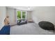 Bright bedroom filled with natural light boasts large windows and a cozy reading nook at 3218 Gilroy Dr, Fort Mill, SC 29707