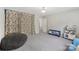 Neutral bedroom features a fun, patterned curtain and play area, perfect for a space at 3218 Gilroy Dr, Fort Mill, SC 29707